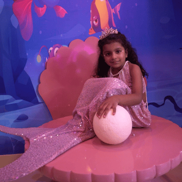 Child dressed as a mermaid enjoying a magical underwater-themed play experience at Wooray Patna.