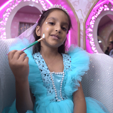 Child dressed as a princess enjoying a magical play experience at Wooray Patna.