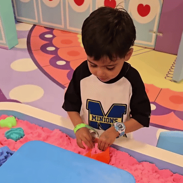 Child enjoying a colourful sensory play activity at Wooray Patna indoor play area.
