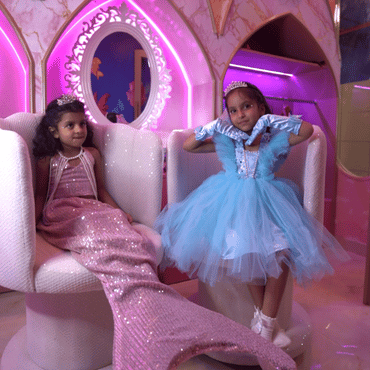 Two children dressed as princesses enjoying a magical themed play experience at Wooray Patna.